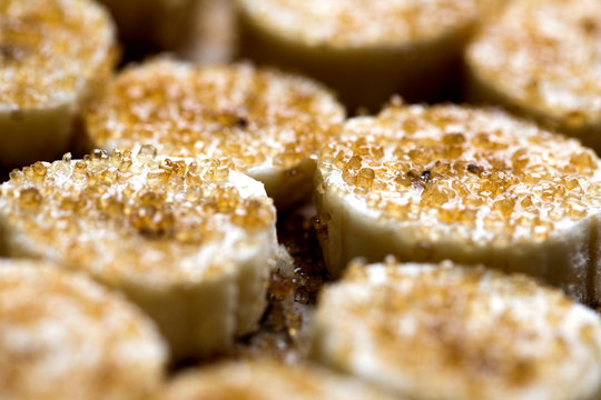 View of caramelizing banana slices with sugar crystals