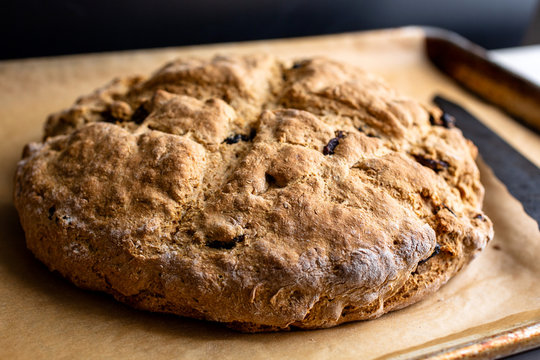 Selective focus of soda bread with walnuts and raisins