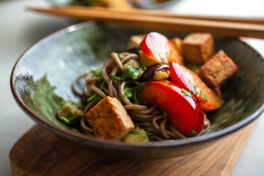 Selective focus of noodles with soba and herb