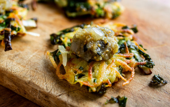 Selective focus of latkes topped with mixed vegetable