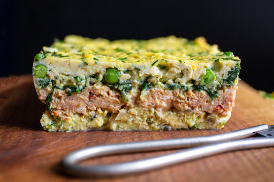 Selective focus of omelet on wooden board