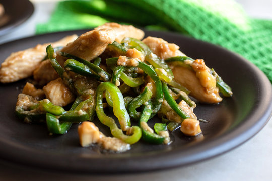 Stir fried chicken with mixed sweet and hot peppers and cashews
