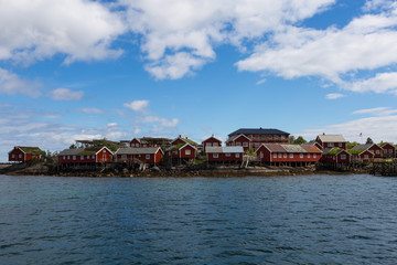 Fototapeta na wymiar Red norwegian houses on the lofoten built close to the water