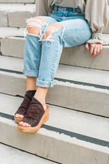 Cute brown leather and wood platform wedges on model