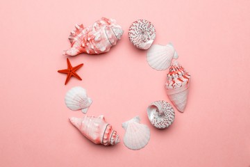 Shells pattern. Trendy Living Coral pastel color Sea shell with starfish and shells in shape frame. Summer background. Top view with copy space.