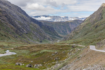 Fototapeta na wymiar Road in Norway mountains in summer season, selective focus.