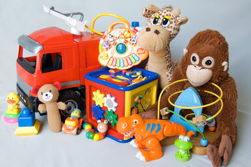 Different toys on a gray background