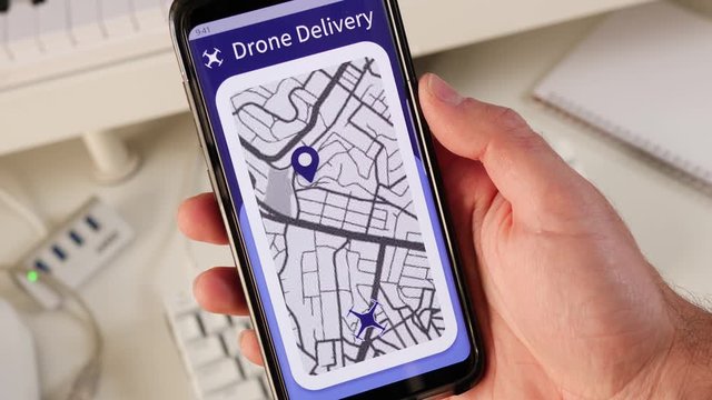 Using a drone delivery service on a smartphone app showing on an interactive map the flying drone getting closer.