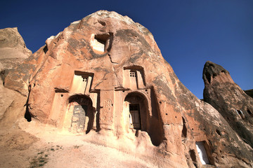Unusually shaped volcanic rocks in the Pink Valley near the village of Goreme in the Cappadocia region of Turkey.