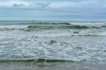 Cloudy day, sand deserted beach of the coast of Haitang Bay in South China Sea. Sanya, island Hainan, China. Nature Landscape.