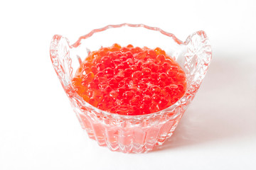 Red salmon caviar in a glass caviar bowl