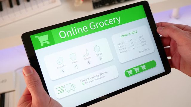 Ordering food from a grocery store online with a tablet device. Receiving the grocery directly at the door step.