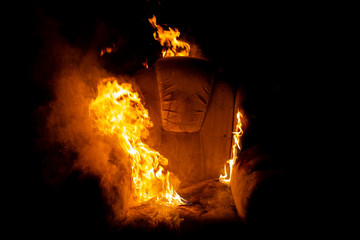 burning armchair close-up on a black background