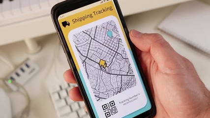 Tracking a parcel using a mobile phone app showing the delivery truck driving on the street.