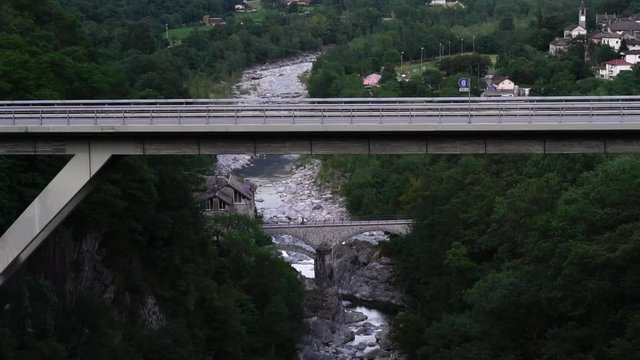 Viaduct & bridge seen from scenic train Centovalli Railway Locarno-Domodossola. Swiss Alps, Ticino Switzerland tourism in summer. Slow motion.