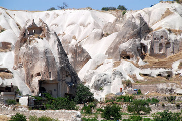 fairy chimney rock village of Göreme in Cappadocia with rock houses and mosque is UNESCO world...