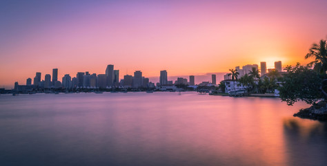 Fototapeta na wymiar skyline miami city night sunset landscape aquatic downtown orange sky buildings architecture river dusk florida