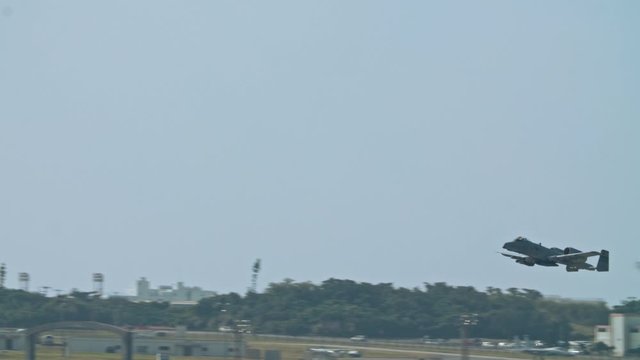 Kadena AB Okinawa Japan Feb 21 2020 Military aircraft taking off and on runway fighter jet, refueler, air tanker, A10, F15,C130 USAF