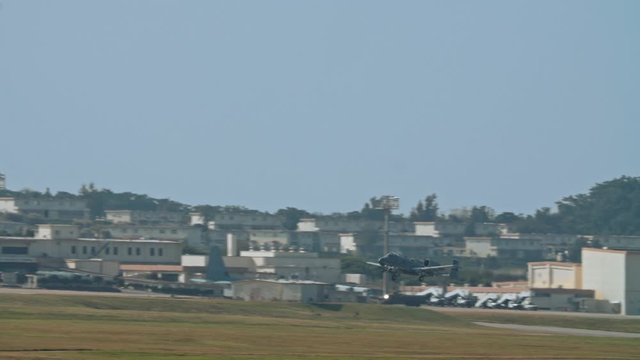 Kadena AB Okinawa Japan Feb 21 2020 Military aircraft taking off and on runway fighter jet, refueler, air tanker, A10, F15,C130 USAF