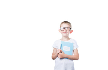 schoolboy holding a notebook in hands