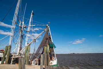 Fototapeta na wymiar Rigging and netting on a shrimp boat