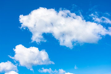 gorgeous cloudscape in springtime. weather background with dynamic cloud arrangement on a blue sky....