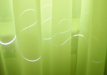 drawing light on green curtains. Abstraction of light. Zigzag