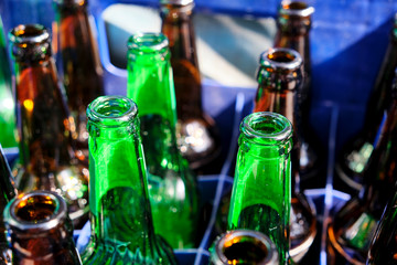 A shot of empy glass bottles ready to be recycled.