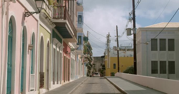 Pastel colored building line a narrow street in Old San Juan Puerto Rico