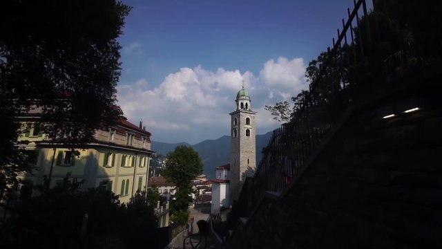 Lugano Cathedral of Saint Lawrence. Lake Lugano. Ticino, Switzerland summer tourism. Slow motion.