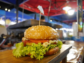 Street burger food with massive lettuce