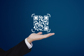 Hand holding QR code on hand. QR code scanning payment and verification technology