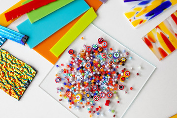 Multi-colored glass for fusing on a white table, close-up