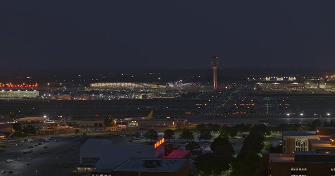 Atlanta Aerial v534 Fast panoramic of airport at dusk, night with numerous planes in sky - July 2019