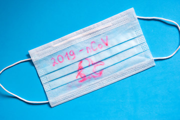 Facial mask on blue background. Medical background. Virus protection concept. Coronavirus wuhan...