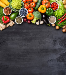 Dieting and healthy eating concept: fruits, vegetables, vegan food ingredients over natural background.