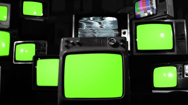 Ten Old TVs turning on Green Screens. BW Tone. You can replace green screen with the footage or picture you want. You can do it with &ldquo;Keying&rdquo; effect in After Effects.