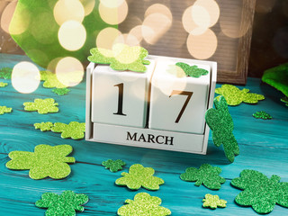 St Patrick's Day holiday concept on dark green wooden rustic background with shamrocks and...