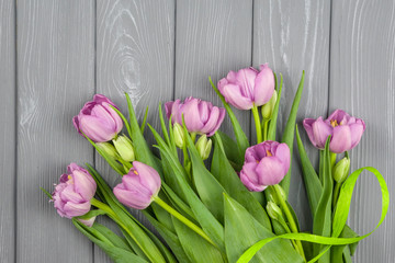 bouquet of pink tulips on wooden background