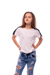 Obraz premium Shot of a young confident girl standing with her hands on her hips, isolated