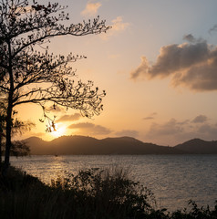Fototapeta na wymiar Boat silhouette and landscapes in songkhla lake