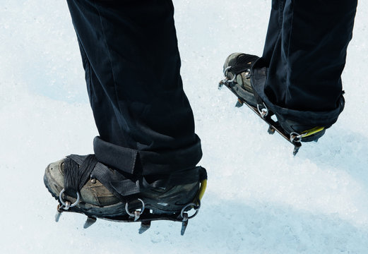 Hiking boots with crampons standing on the perito moreno glacier, Argentina, Patagonia, South America