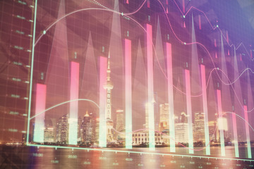 Financial graph on night city scape with tall buildings background multi exposure. Analysis concept.