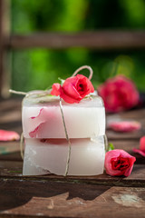 Cubes of handmade rose soap wrapped in a string