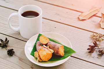 Black coffee served with sweet potato boiled.