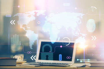 Multi exposure of table with computer and world map hologram. International data network concept.