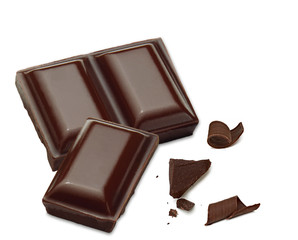 Broken chocolate parts and curls isolated on white background with clipping path