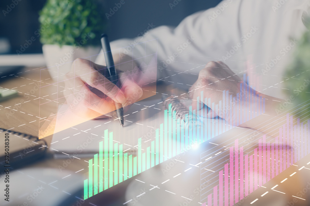 Wall mural Financial forex graph displayed on hands taking notes background. Concept of research. Double exposure