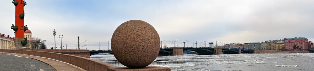 : St. Petersburg, Russia, February 2020. Granite ball on the waterfront and panorama of the city. 