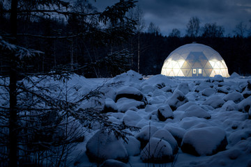 Igloo at night in the boreal forest.